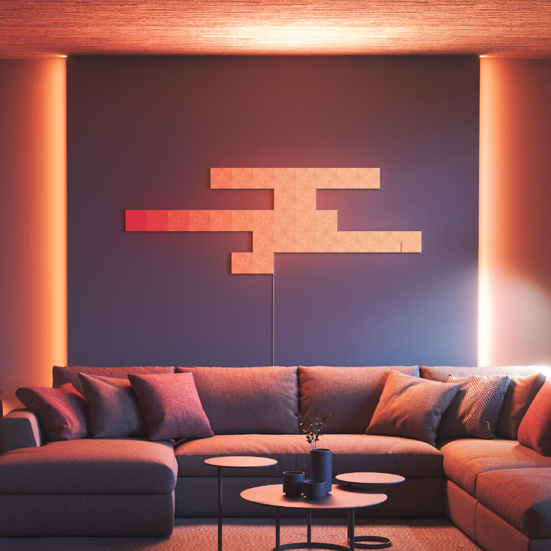 Nanoleaf Canvas color changing square smart modular light panels mounted to a wall in a living room. Similar to Philips Hue, Lifx. HomeKit, Google Assistant, Amazon Alexa, IFTTT.